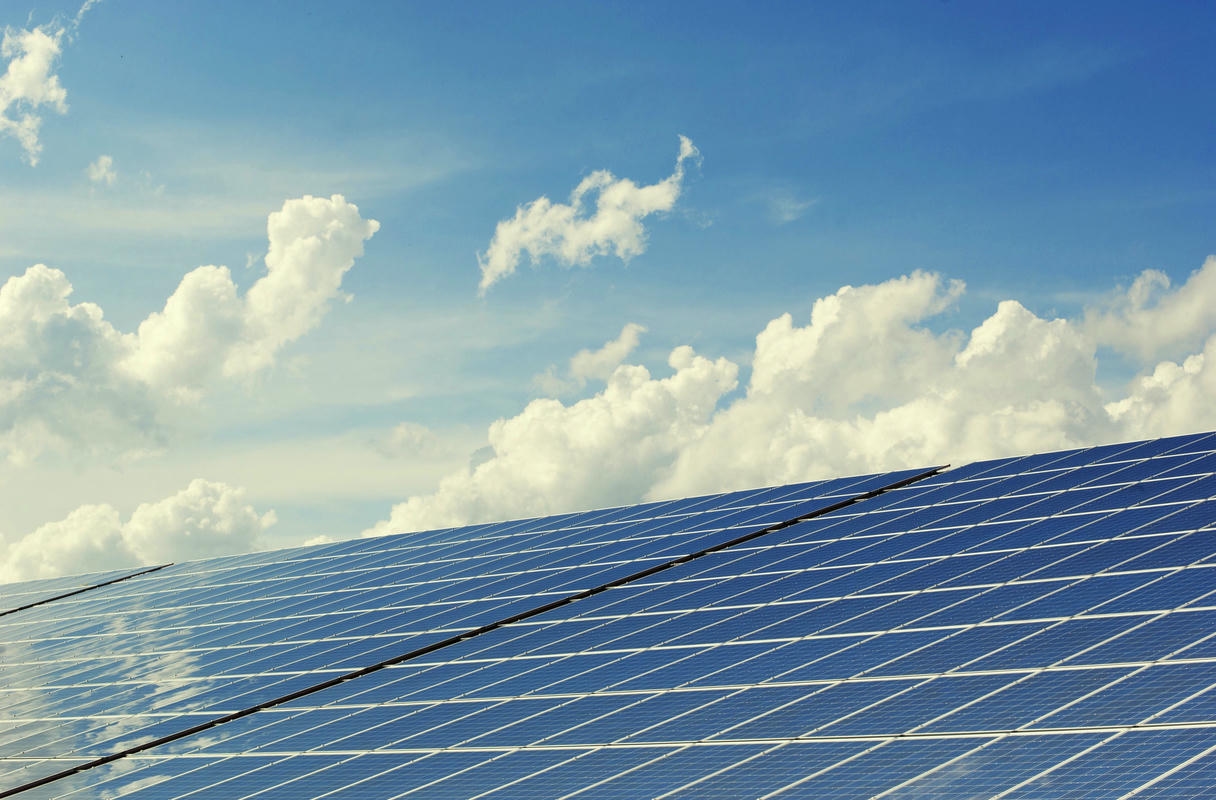 Solar panels powering industrial facilities